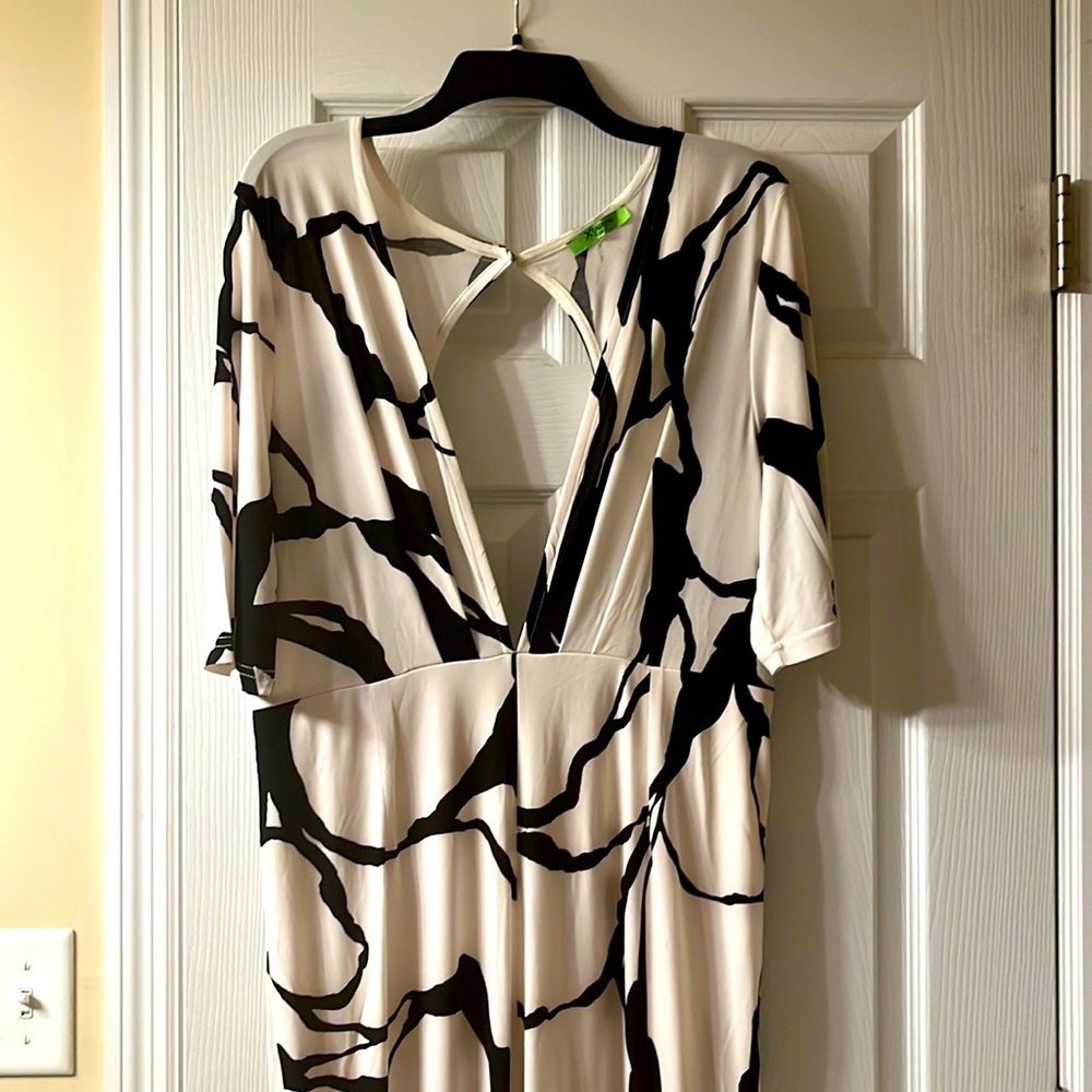 Fun one piece jumpsuit. Deep V. Backless fits like 1X. Runs small.